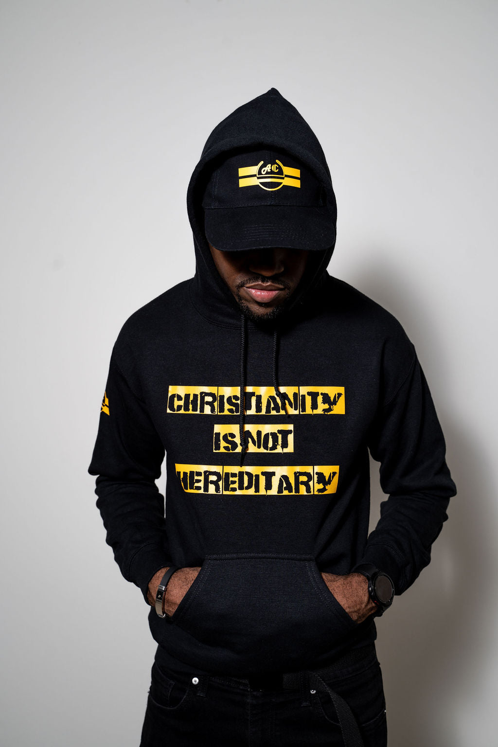CHRISTIANITY IS NOT HEREDITARY HOODIE Black and Yellow